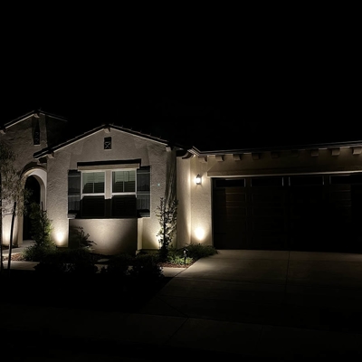 Landscape lighting highlights trees and adds beauty to this home in Sierra Foothills. Photo